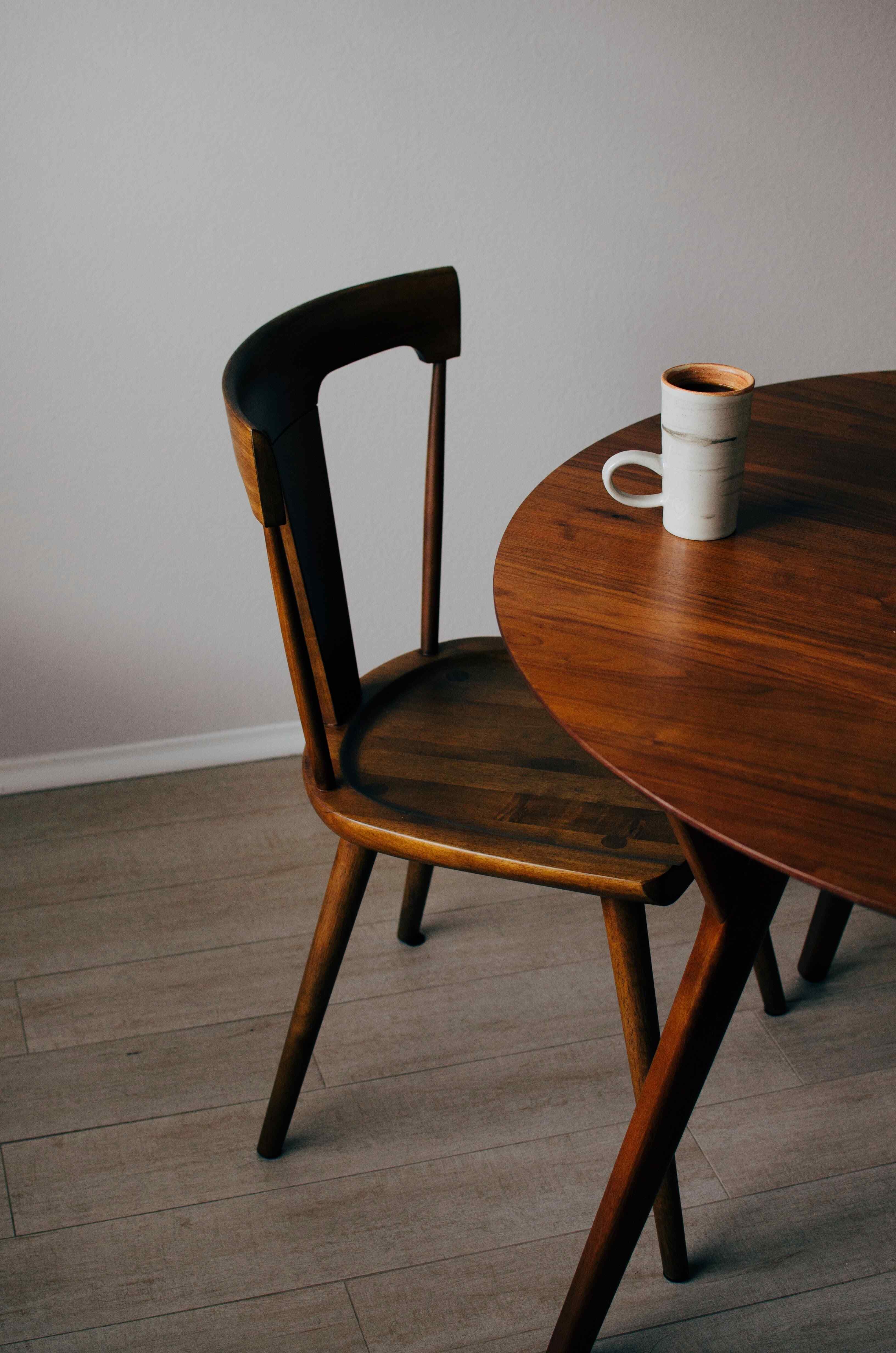 An inviting setup featuring a wooden table and chair