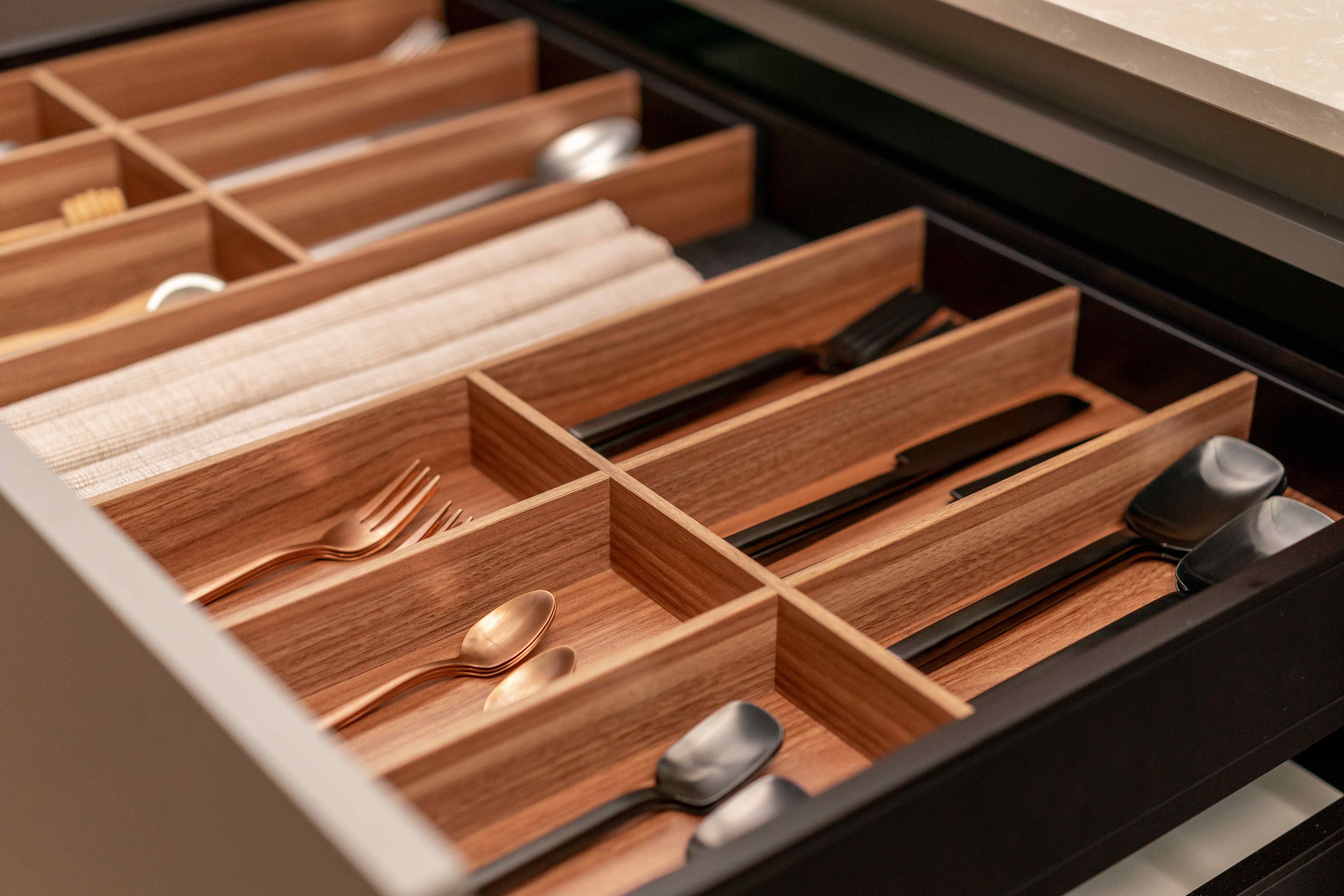A drawer filled with various utensils and silverware neatly organized for easy access.