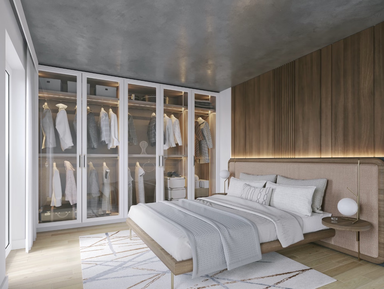Modern bedroom with built-in closets and wooden bed